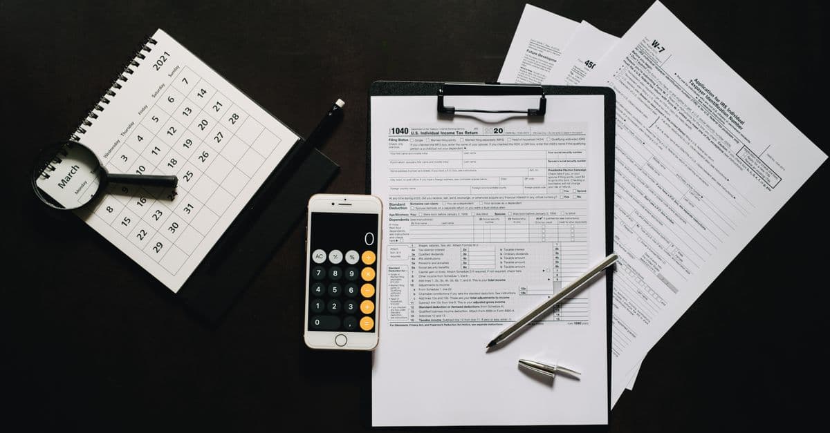 IRS-style tax forms and paperwork on a desk