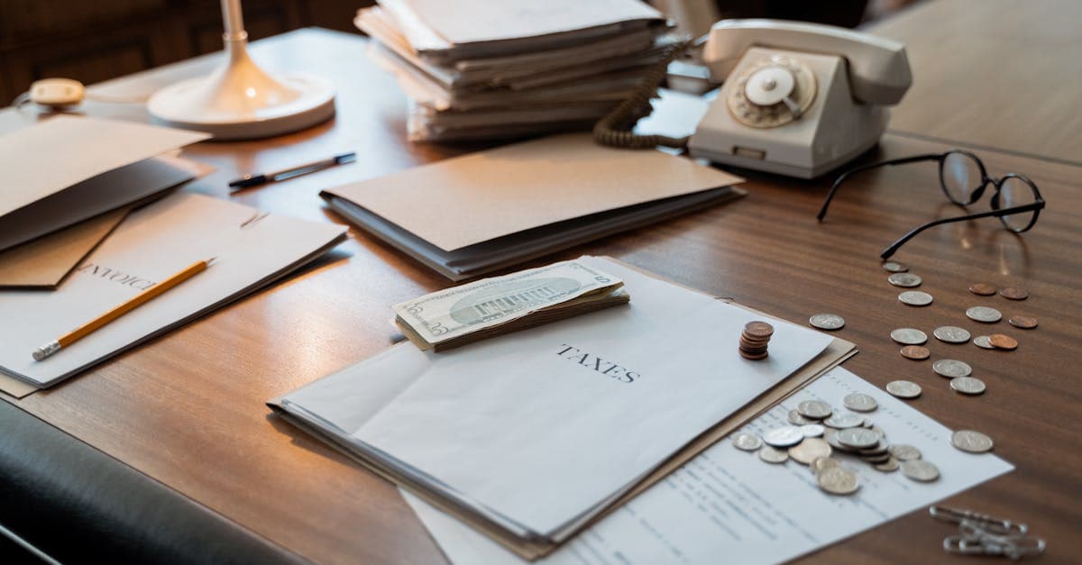 Tax paperwork and documents stacked on a desk