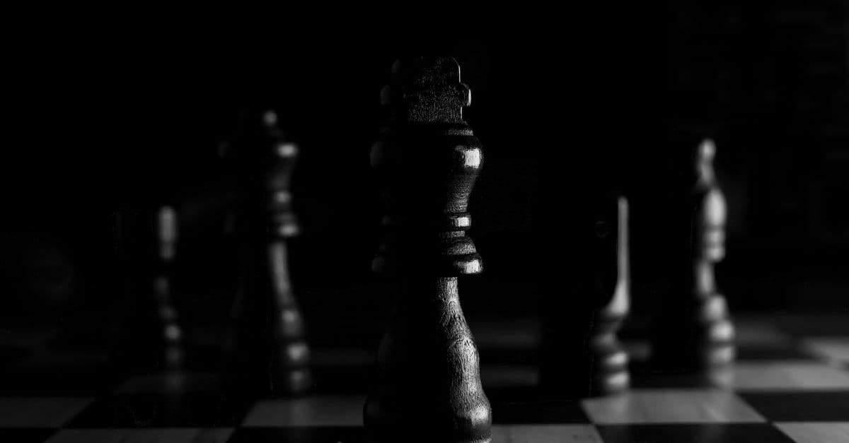 Chess pieces on a board representing strategy and trade-offs